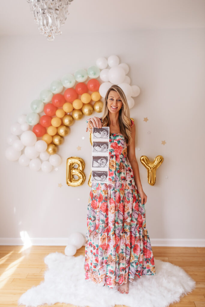 DIY Rainbow Baby Pregnancy Announcement. Rainbow balloon wall pregnancy announcement. Rainbow baby balloon backdrop for photos.