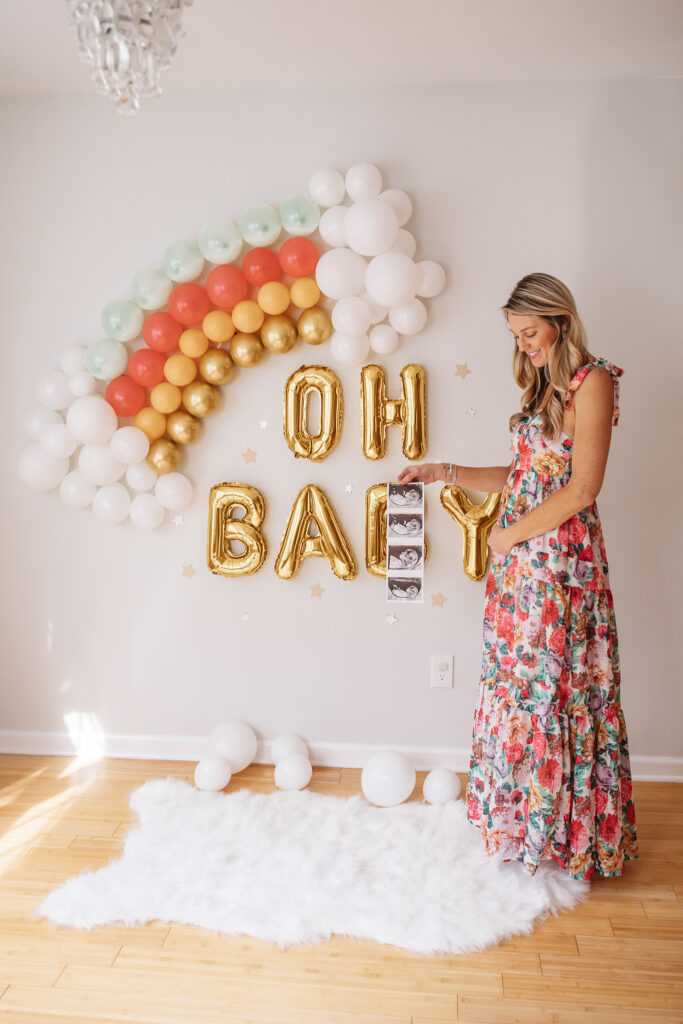 DIY Rainbow Baby Pregnancy Announcement. Rainbow balloon wall pregnancy announcement. Rainbow baby balloon backdrop for photos.