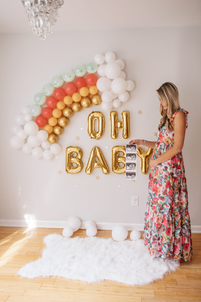 DIY Rainbow Baby Pregnancy Announcement. Rainbow balloon wall pregnancy announcement. Rainbow baby balloon backdrop for photos.