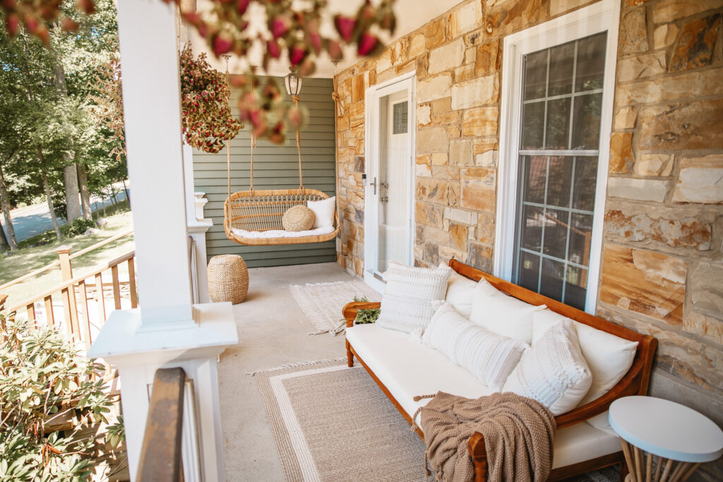 Neutral Front Porch Decor - Create a Front Porch Oasis. Hanging porch swing and oversized outdoor sofa.