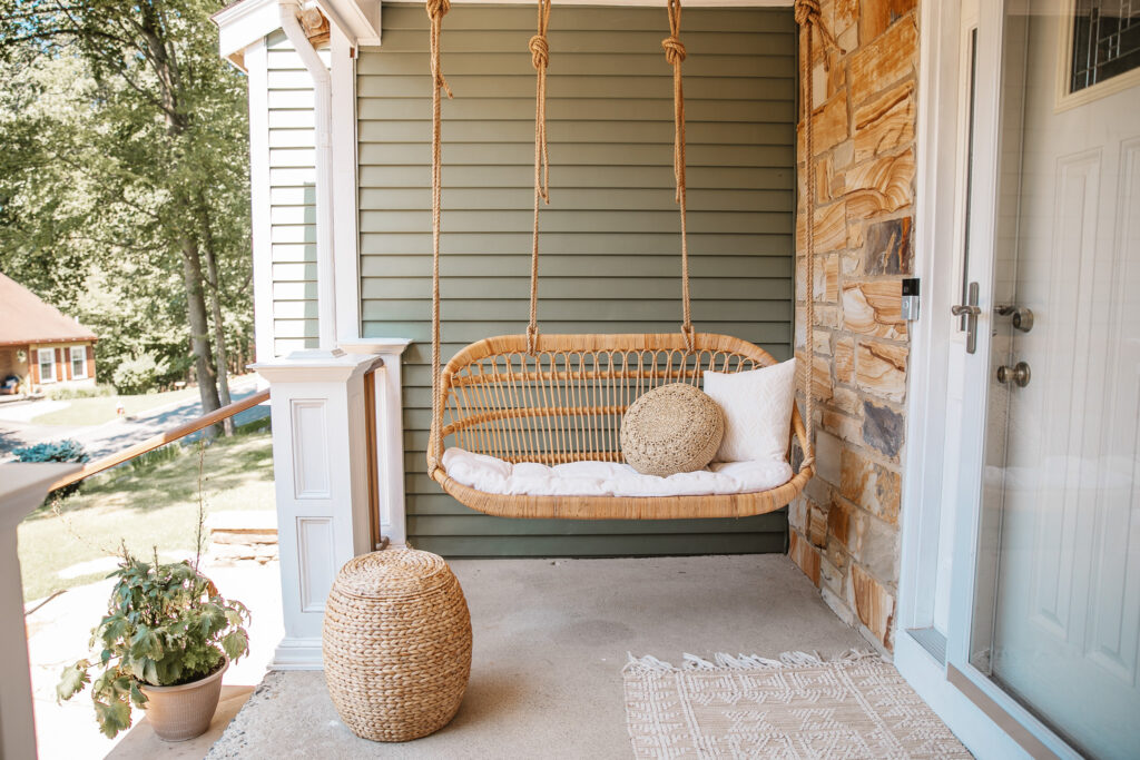 Neutral Front Porch Decor - Create a Front Porch Oasis. Hanging porch swing and oversized outdoor sofa.