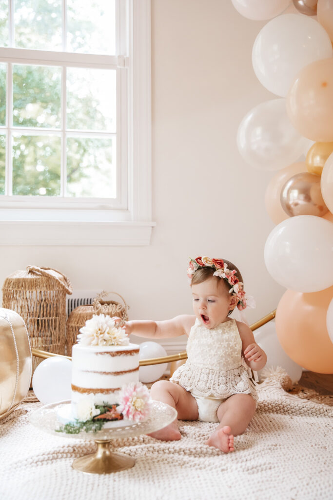 Isn't She ONEderful Boho First Birthday Cake Smash Inspo. Boho baby girl birthday. boho balloon garland. baby girl boho style onesie and flower crown.