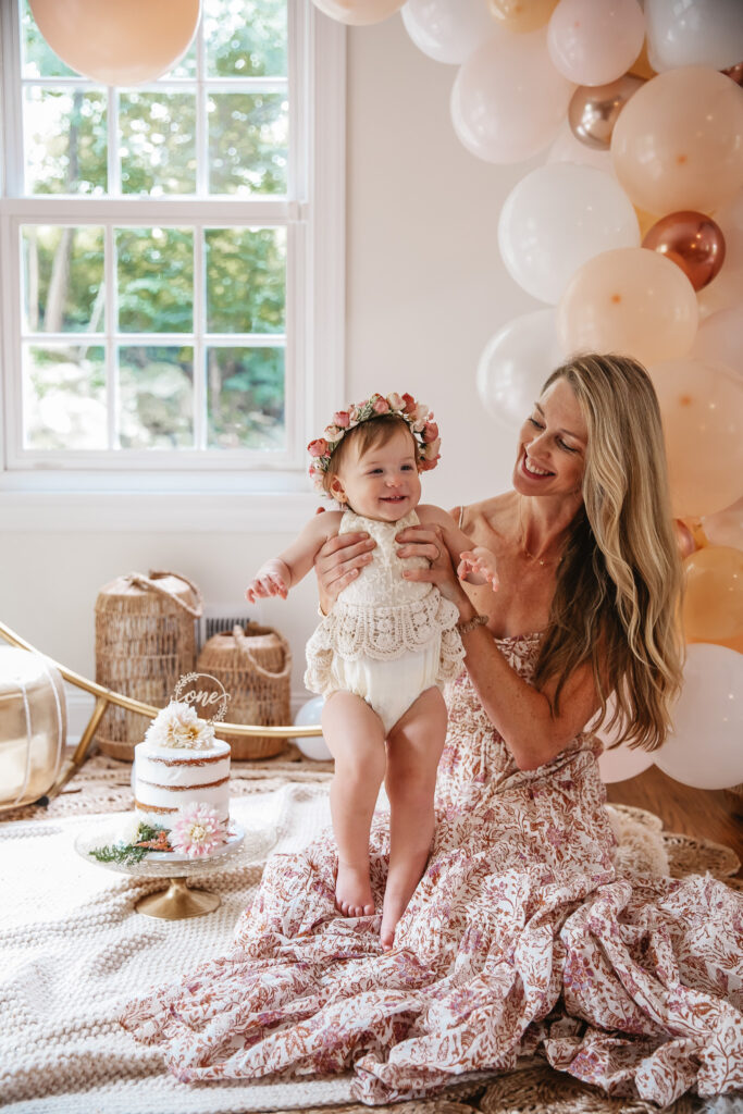 Isn't She ONEderful Boho First Birthday Cake Smash Inspo. Boho baby girl birthday. boho balloon garland. baby girl boho style onesie and flower crown.