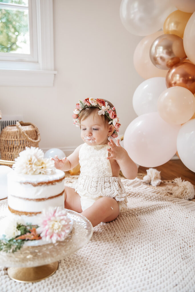 Isn't She ONEderful Boho First Birthday Cake Smash Inspo. Boho baby girl birthday. boho balloon garland. baby girl boho style onesie and flower crown.