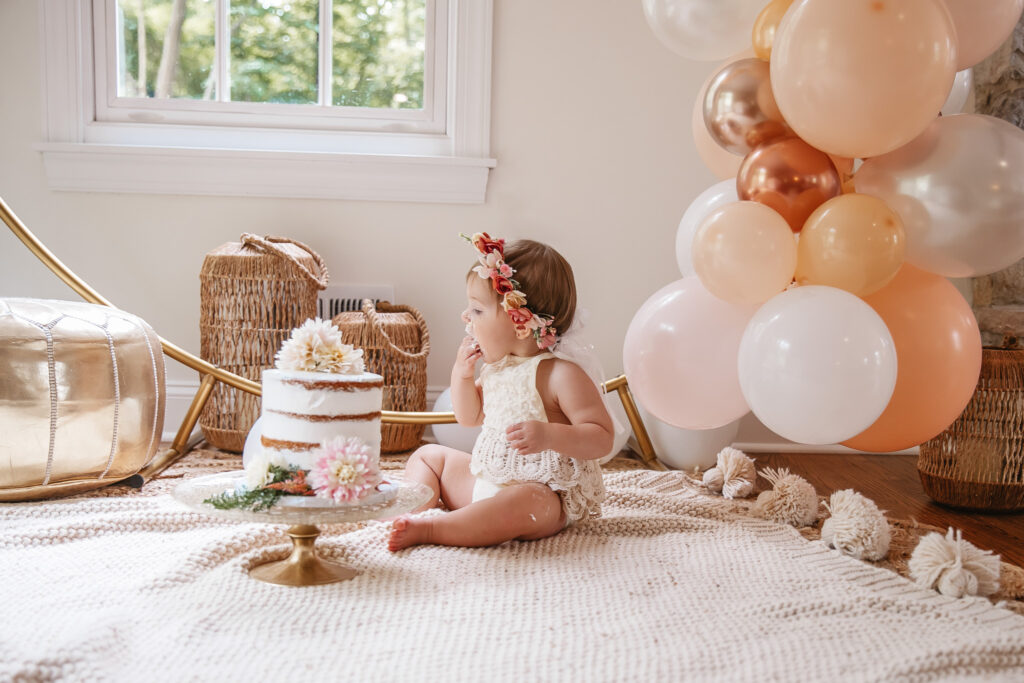 Isn't She ONEderful Boho First Birthday Cake Smash Inspo. Boho baby girl birthday. boho balloon garland. baby girl boho style onesie and flower crown.